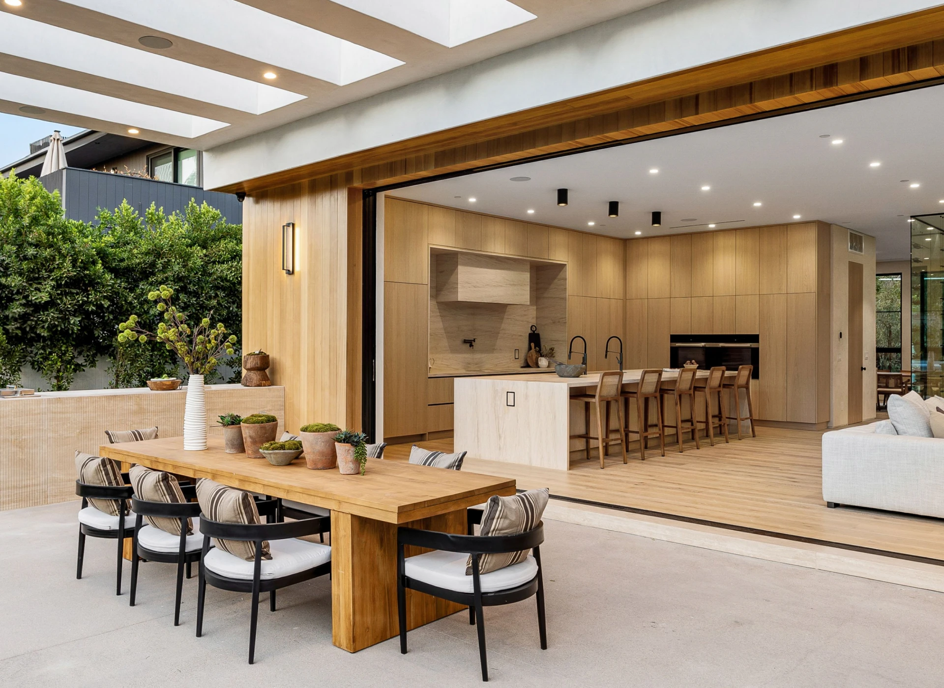Outdoor dining area with modern kitchen