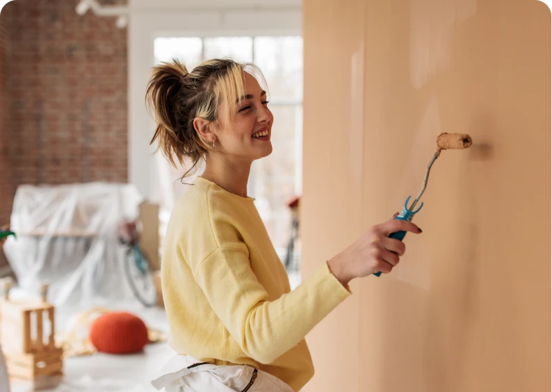 Home renovation with cheerful painter