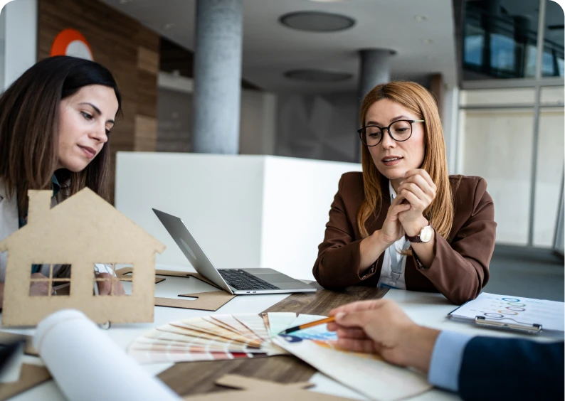 Architects discussing house design plans